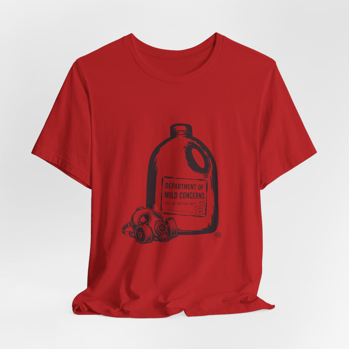 Red t-shirt laid flat with a large gallon milk jug graphic with a gas mask and "Department of Mild Concerns" label