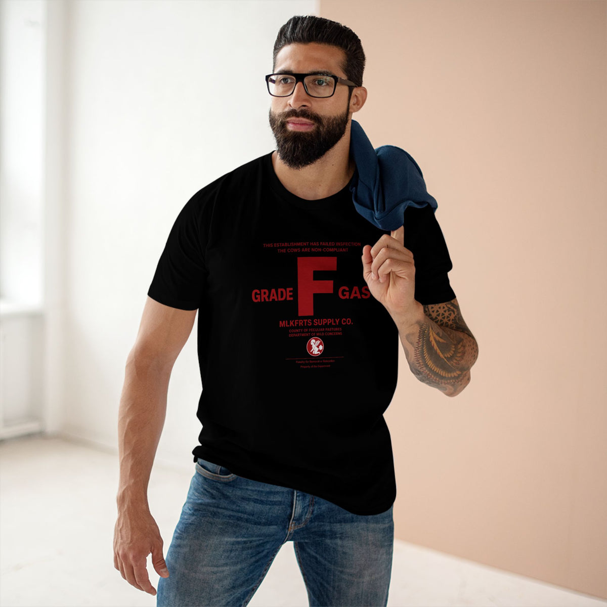 Model wearing the MLKFRTS Grade F Notice of Non-Compliance tee in Black, front view with the red Grade F notice of non-compliance