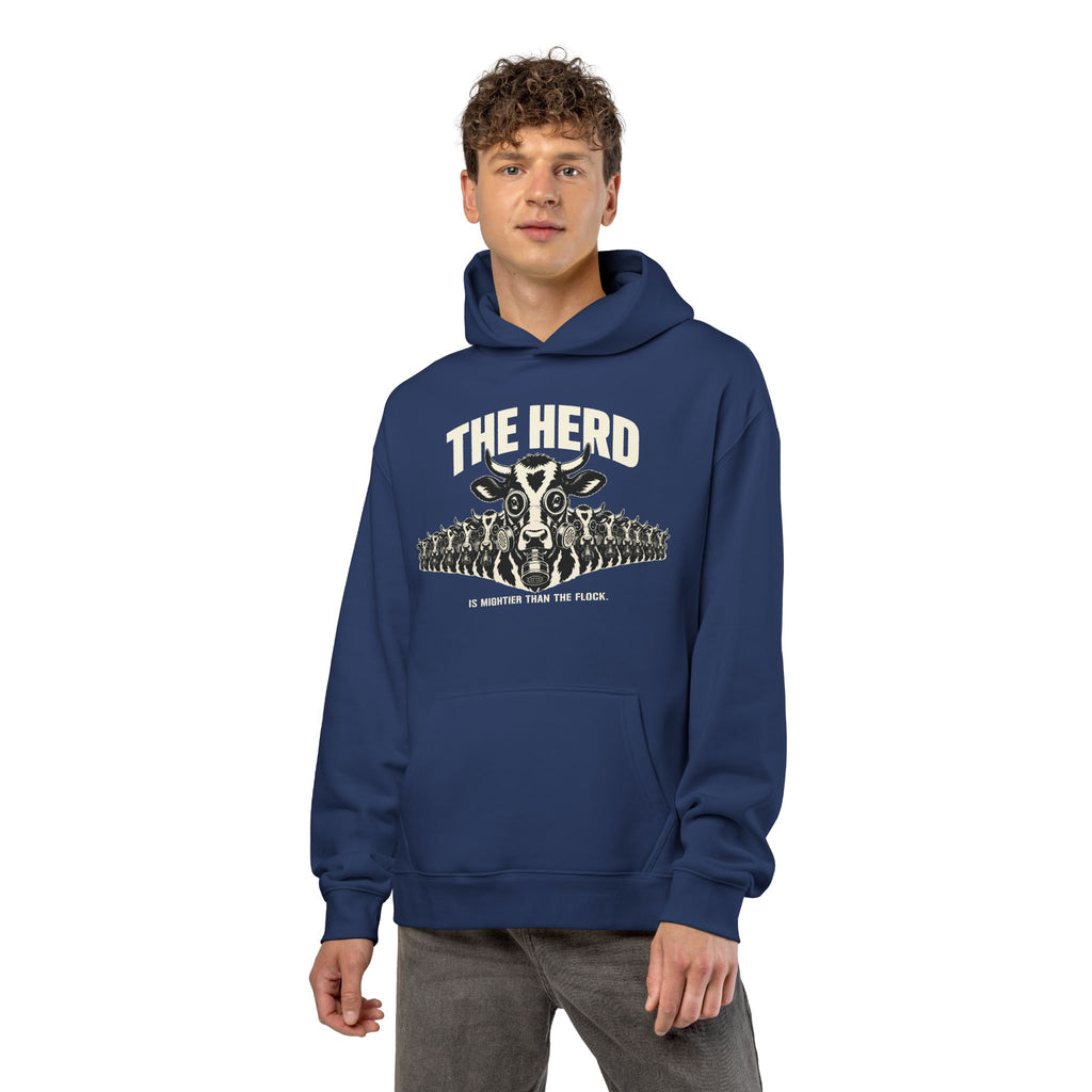 Man wearing the Stampede Hoodie in cobalt, front: gas-mask cow stampede, THE HERD