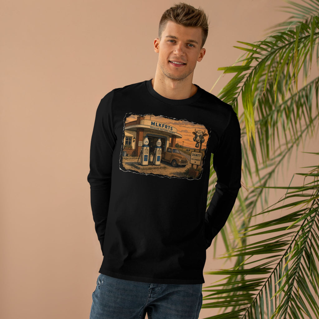 Man wearing the Peculiar Gas Station Long Sleeve Tee in Black, gas station scene on the front