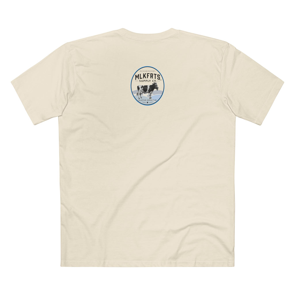 The Refusal Tee in Natural, back: small Flatus Eruptus badge on the upper back, a gas-mask Holstein on blue hills with a star