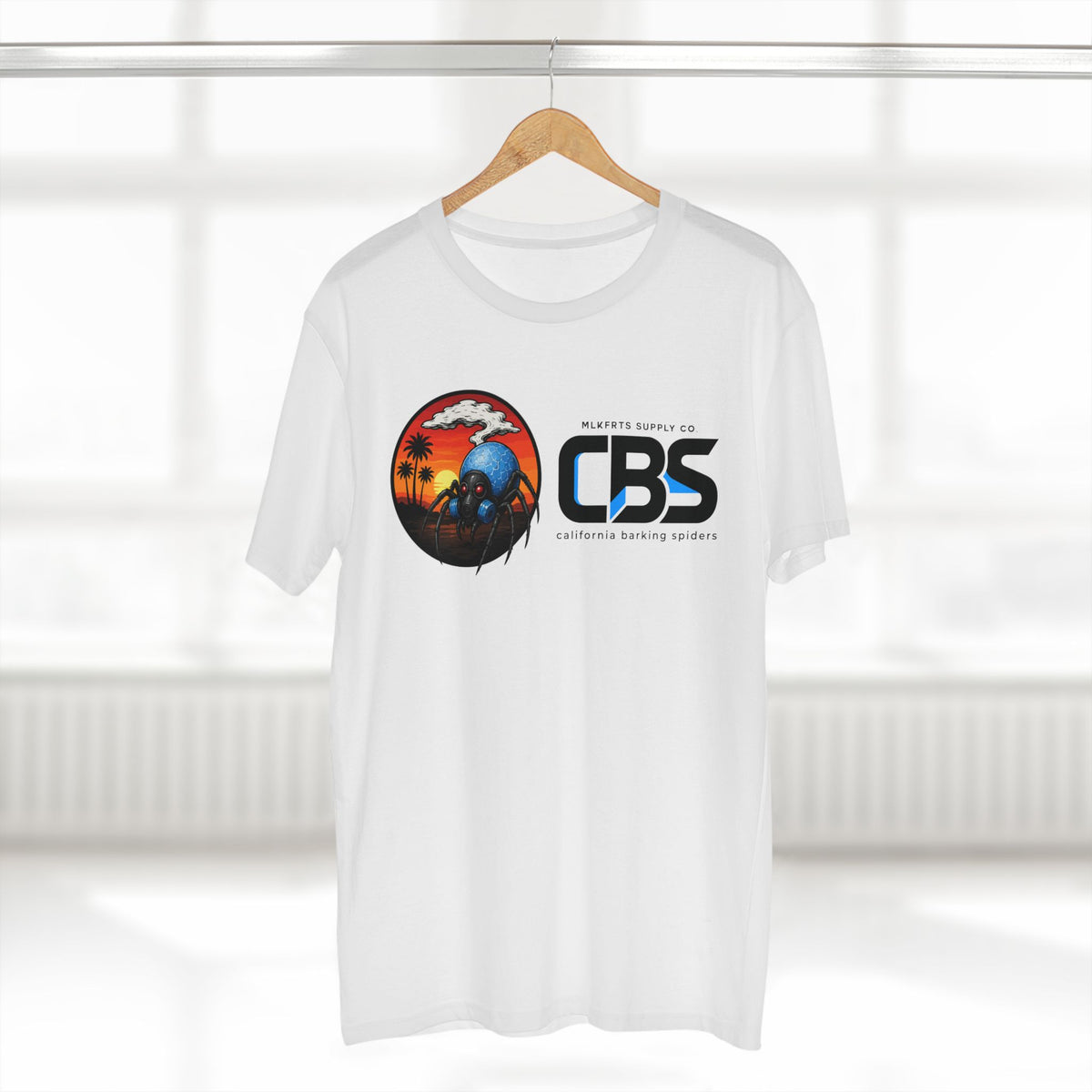 MLKFRTS California Barking Spiders Tee in white on a hanger, front: CBS lockup with the gas-masked spider