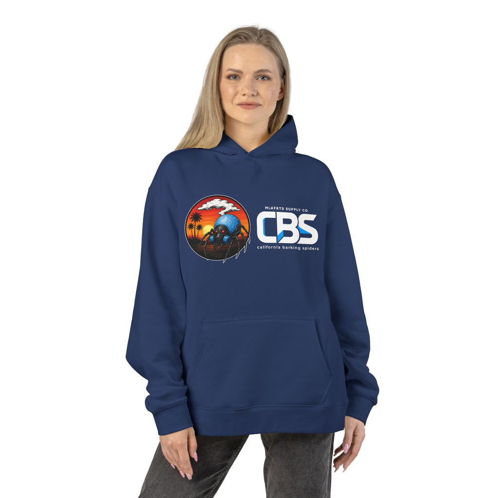 Woman wearing the California Barking Spiders Hoodie in cobalt, front: CBS lockup with the gas-masked spider