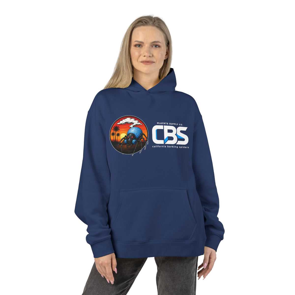 Woman wearing the California Barking Spiders Hoodie in cobalt, front: CBS lockup with the gas-masked spider