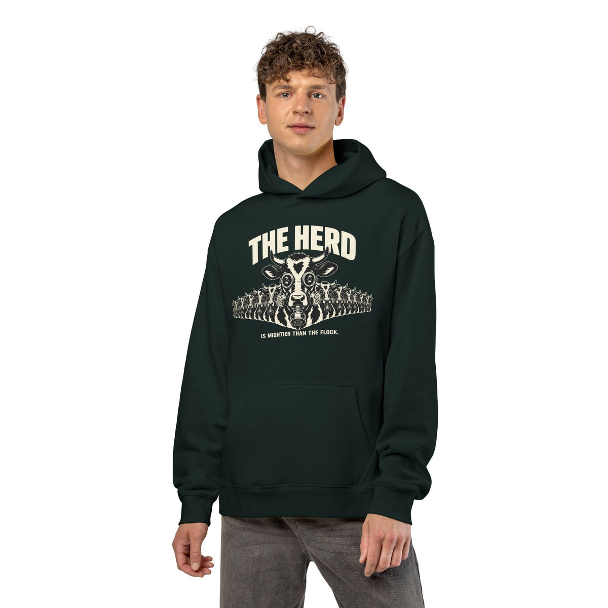 Man wearing the Stampede Hoodie in pine green, front: gas-mask cow stampede, THE HERD