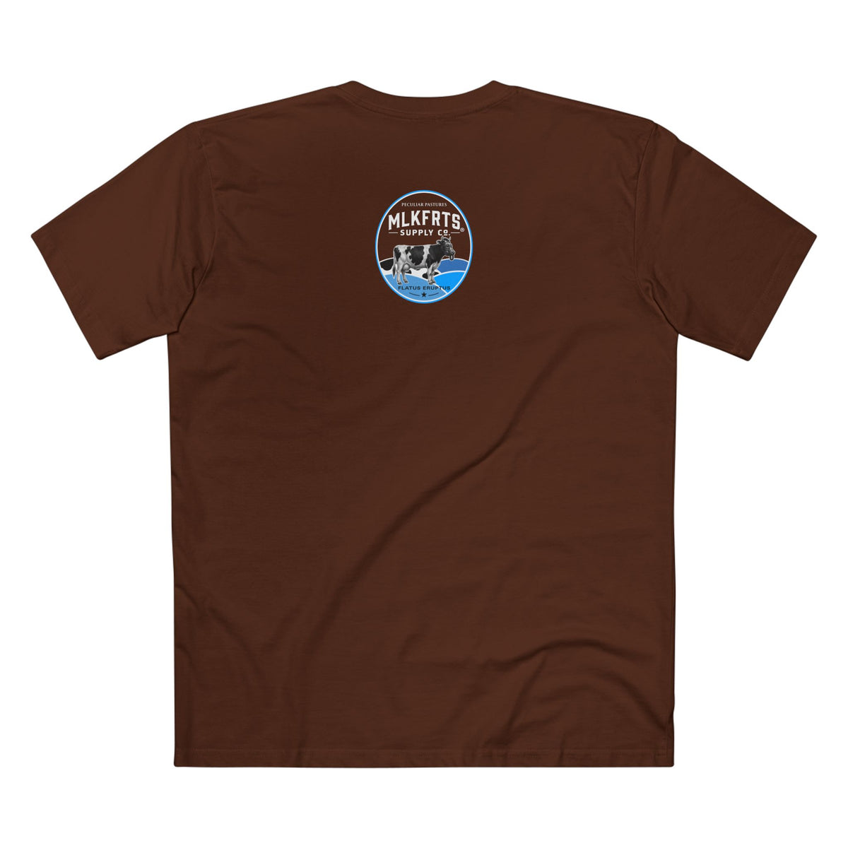 The Refusal Tee in Dark Chocolate, back: small Flatus Eruptus badge on the upper back, a gas-mask Holstein on blue hills with a star