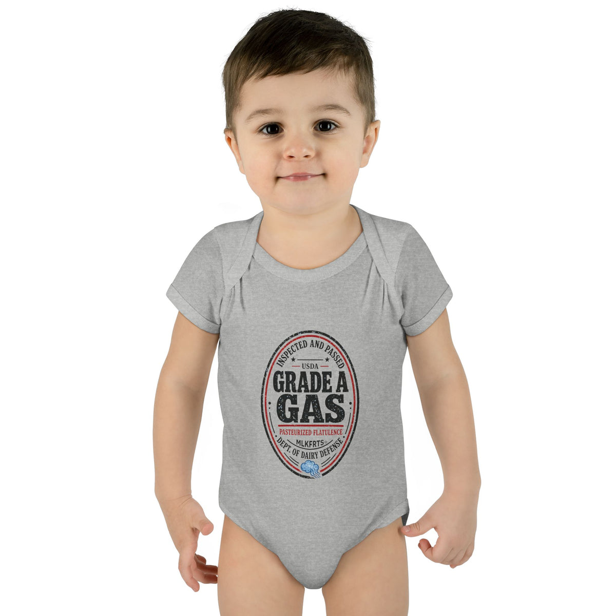 Baby wearing the Heather baby bodysuit with an oval "Grade A Gas" inspection-seal print