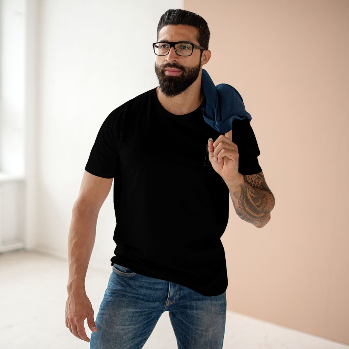 Man wearing the Stay Upwind Tee in black, front: small left-chest elephant