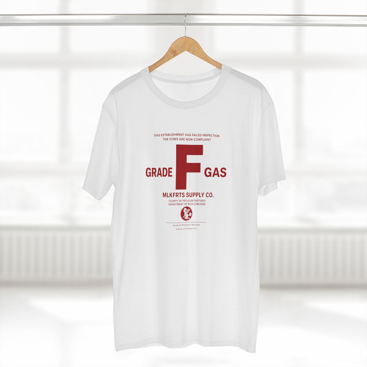 MLKFRTS Grade F Notice of Non-Compliance tee in White on a hanger, front view with the red Grade F notice of non-compliance