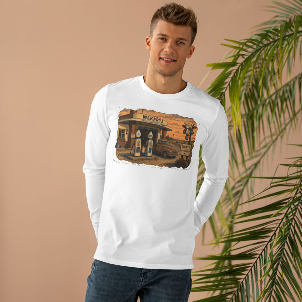 Man wearing the Peculiar Gas Station Long Sleeve Tee in White, gas station scene on the front