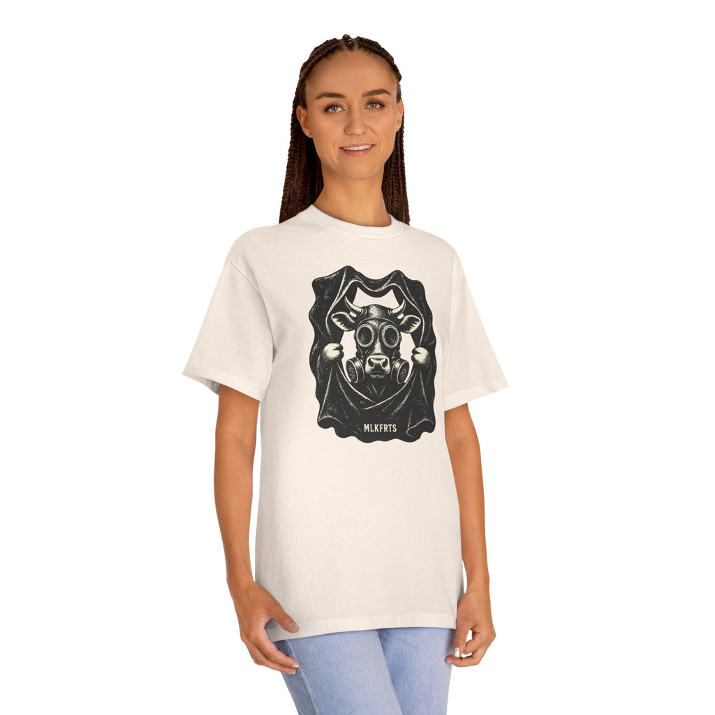 Model wearing the Cream t-shirt with a woodcut-style Holstein cow wearing a gas mask, front view
