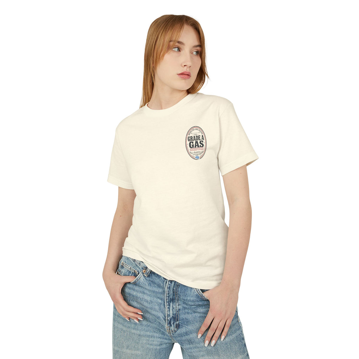 Model wearing the Faded Cream garment-dyed t-shirt with a small oval "Grade A Gas" seal on the left chest, front view