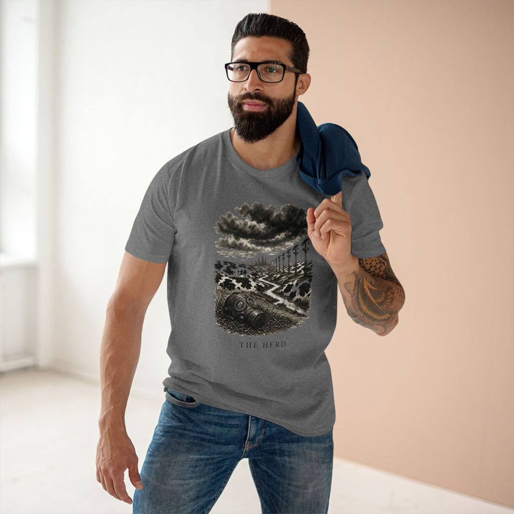 Man wearing The Hills Have Cams Tee in heather grey, front: surveillance poles over Holstein hills, THE HERD.
