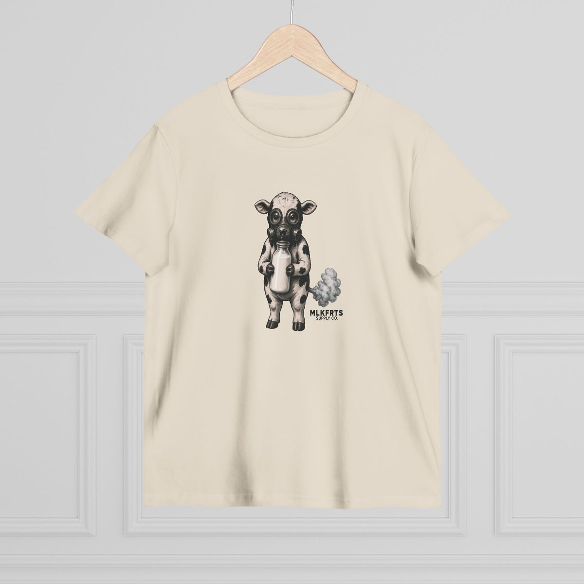 Ecru women's tee with the Calf of Concern on the front, on a hanger