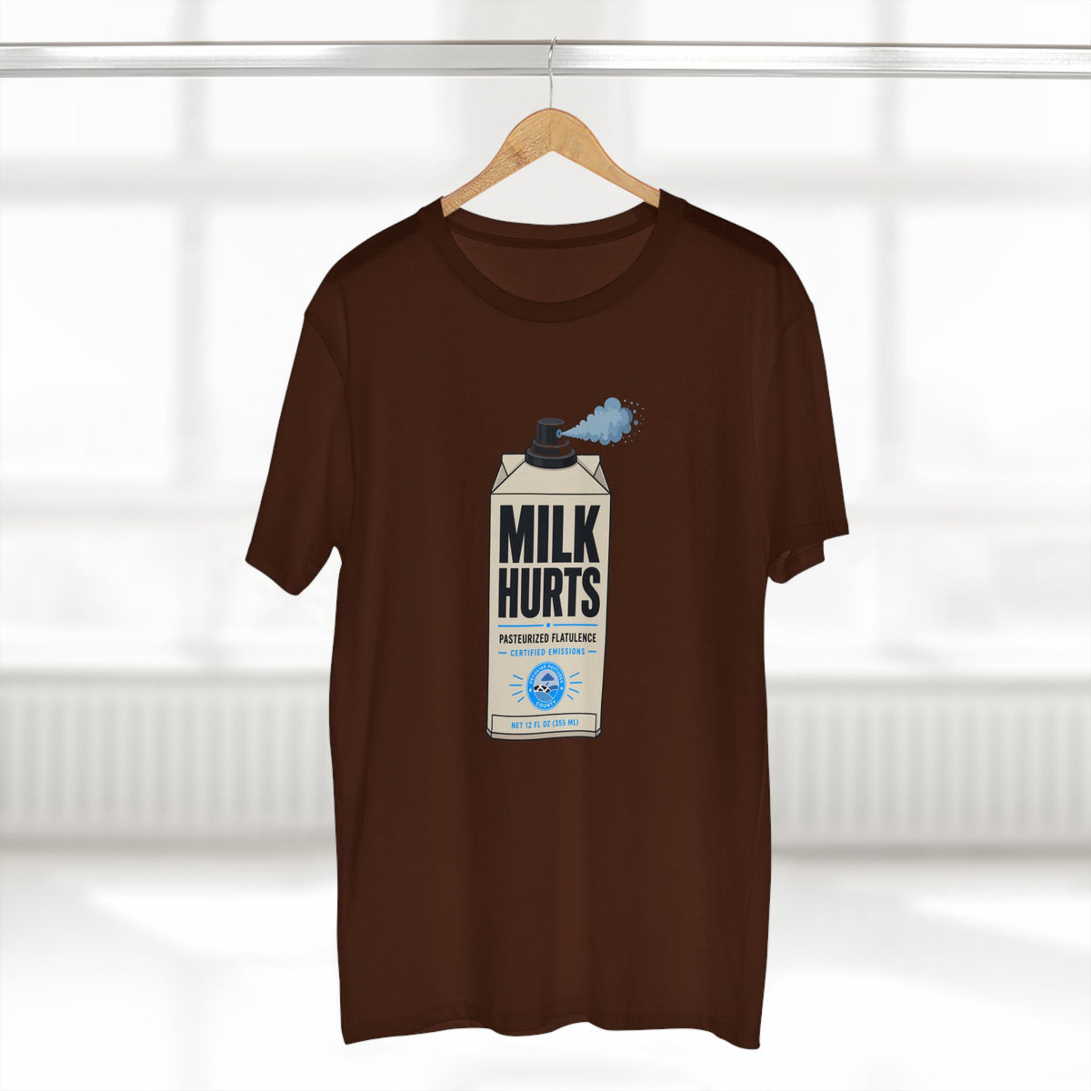 MLKFRTS Milk Hurts Mace Tee in dark chocolate on a hanger, front view showing the Milk Hurts milk carton graphic