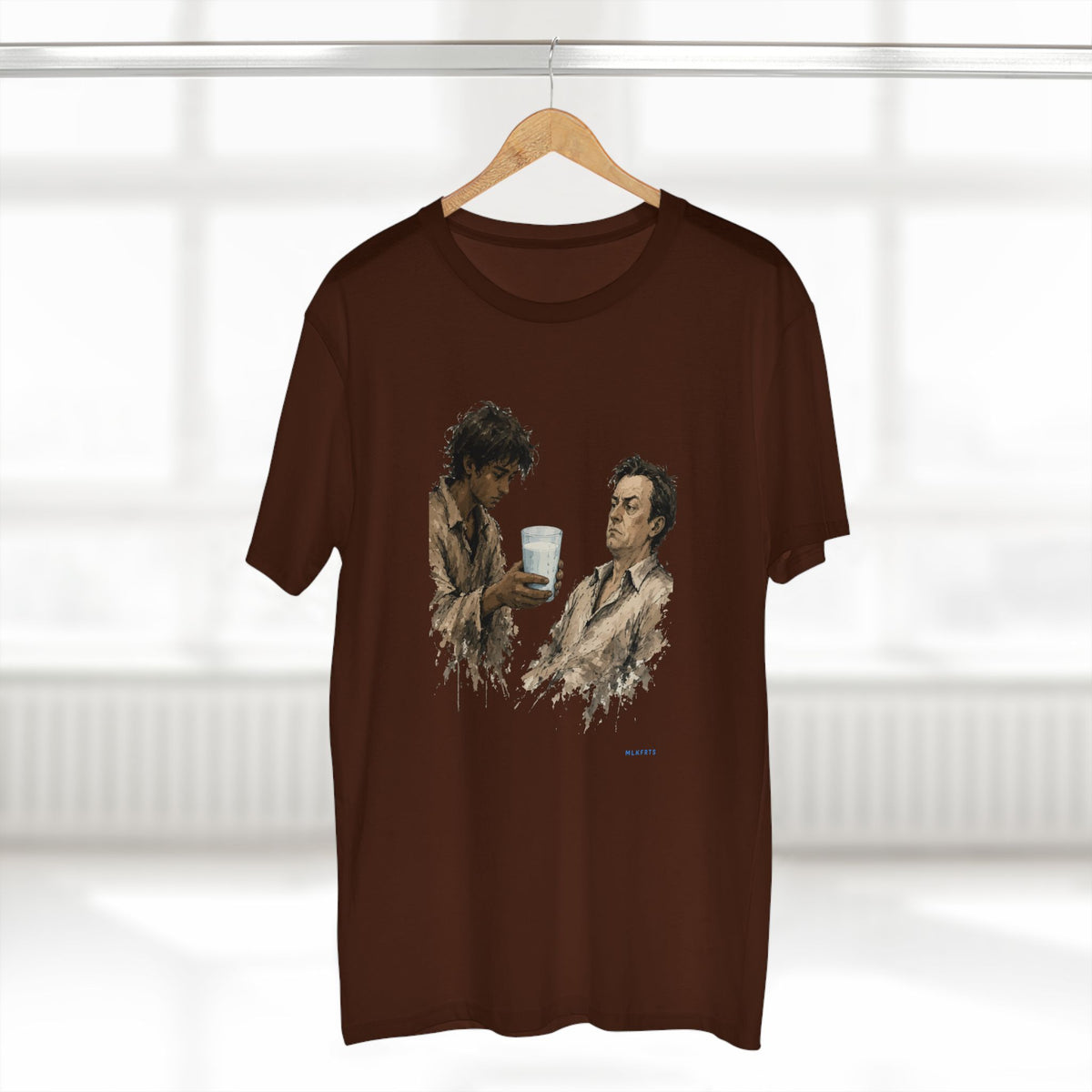 The Refusal Tee in Dark Chocolate on a hanger, close-up of the painterly front art