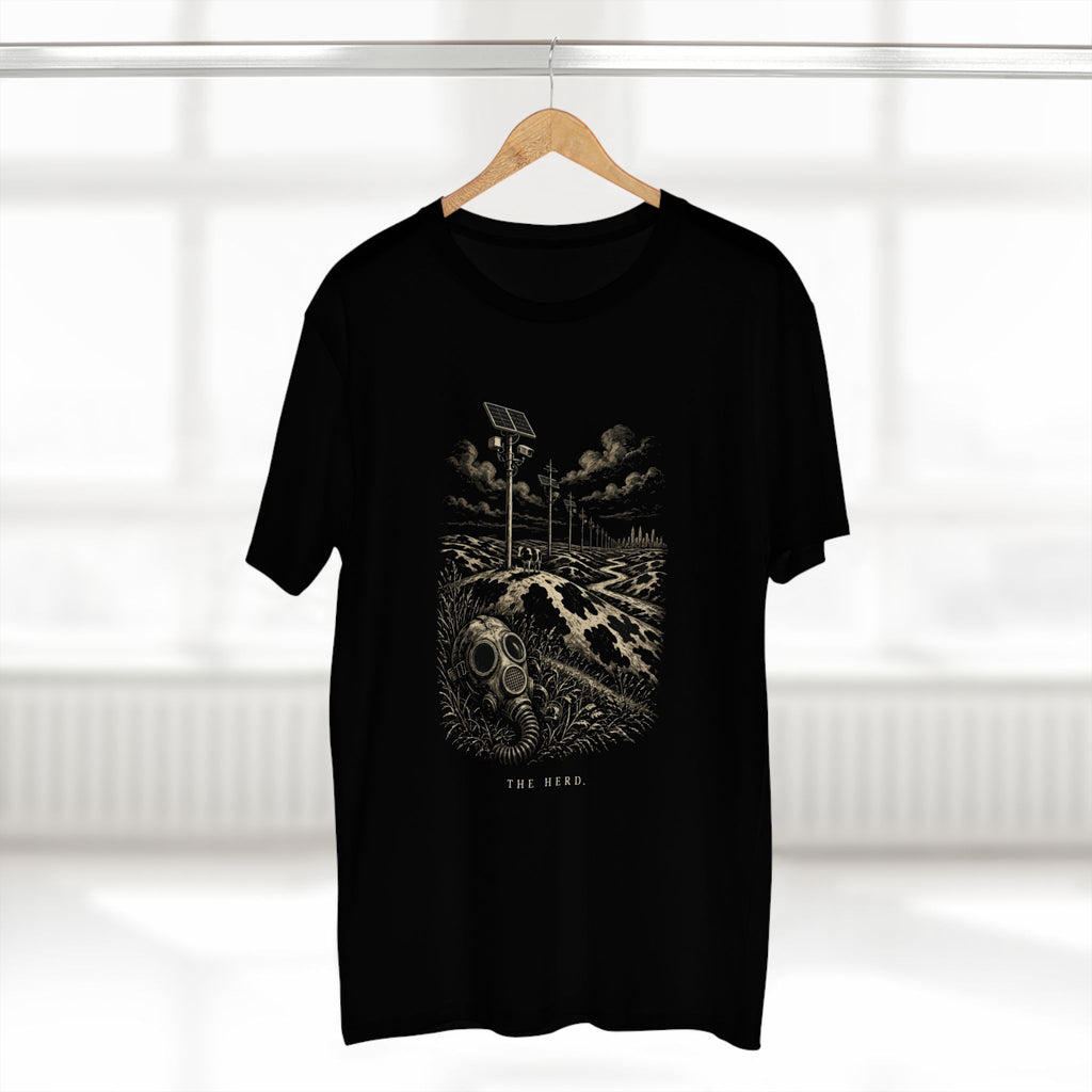 The Hills Have Cams Tee in black on a hanger, front: etched surveillance hills with a gas mask in the grass, THE HERD.