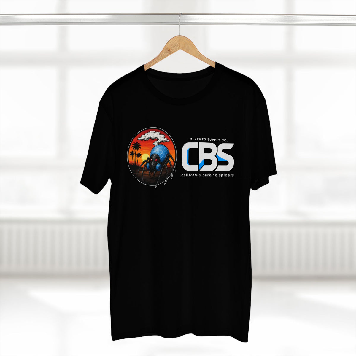 MLKFRTS California Barking Spiders Tee in black on a hanger, front: CBS lockup with the gas-masked spider