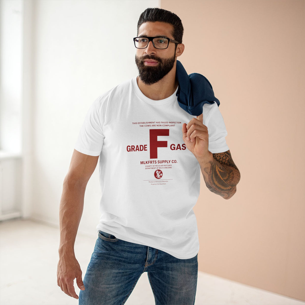 Model wearing the MLKFRTS Grade F Notice of Non-Compliance tee in White, front view with the red Grade F notice of non-compliance