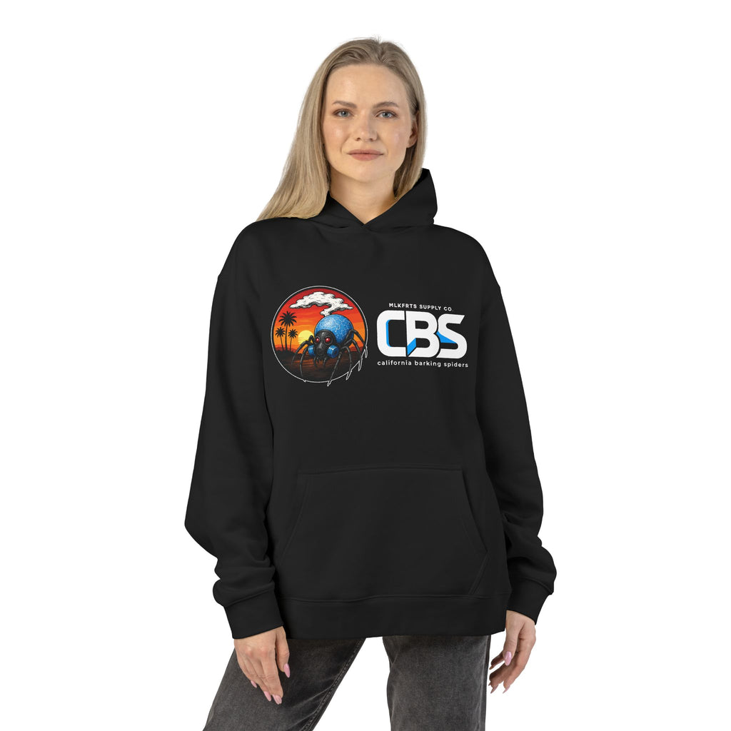 Woman wearing the California Barking Spiders Hoodie in black, front: CBS lockup with the gas-masked spider