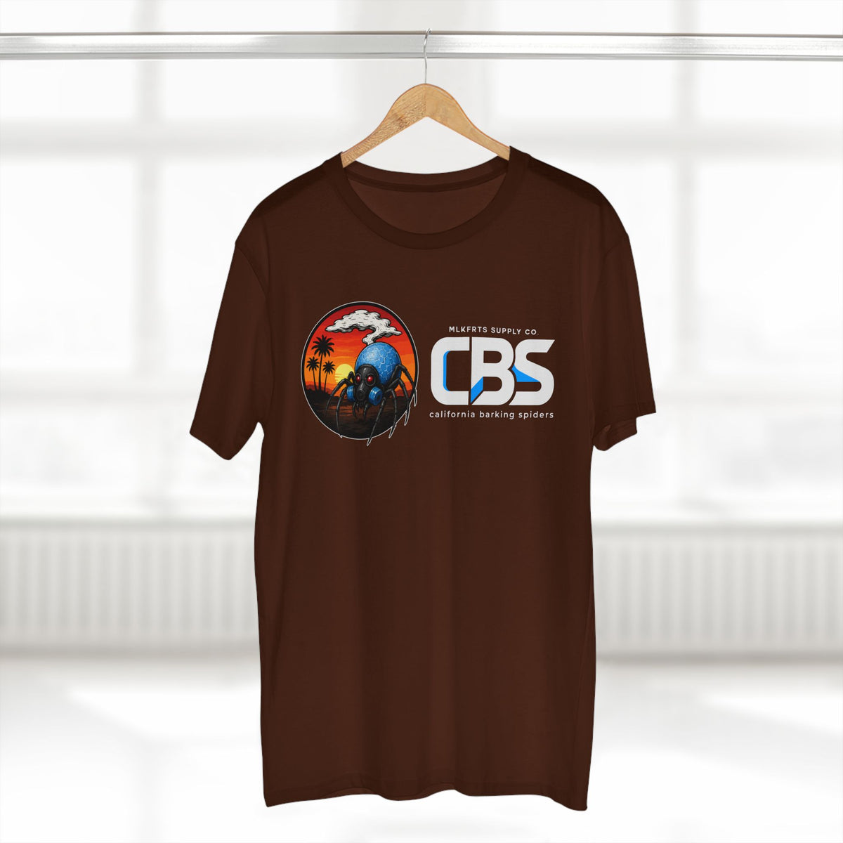 MLKFRTS California Barking Spiders Tee in dark chocolate on a hanger, front: CBS lockup with the gas-masked spider